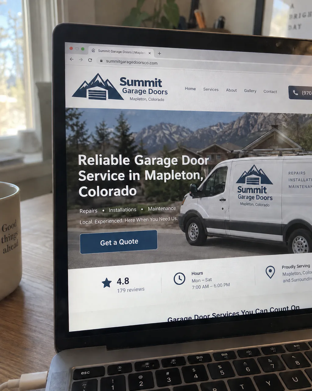 Candid laptop photo showing the finished Summit Garage Doors website